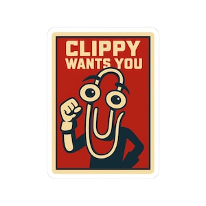 May include: A sticker featuring a cartoon image of Clippy, the Microsoft Office assistant, in a propaganda-style design. The text "Clippy Wants You" is displayed above the character, with a red background and a cream-colored border.