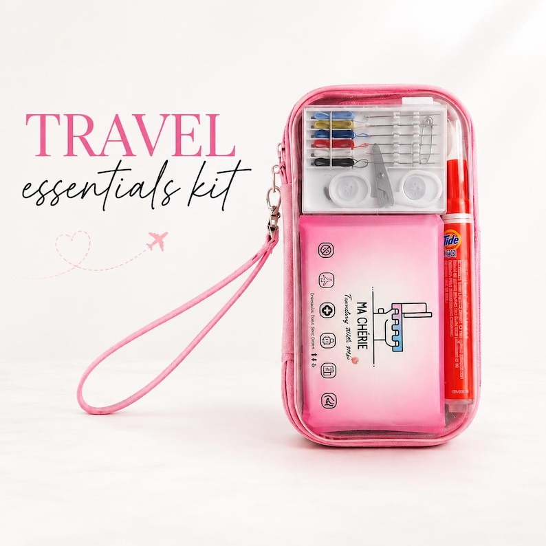 May include: A pink zippered travel pouch with a wrist strap containing a sewing kit with needles and thread, a Tide stain remover pen, and a pink rectangular case labeled MA CHERIE Traveling With Me with icons for travel essentials.