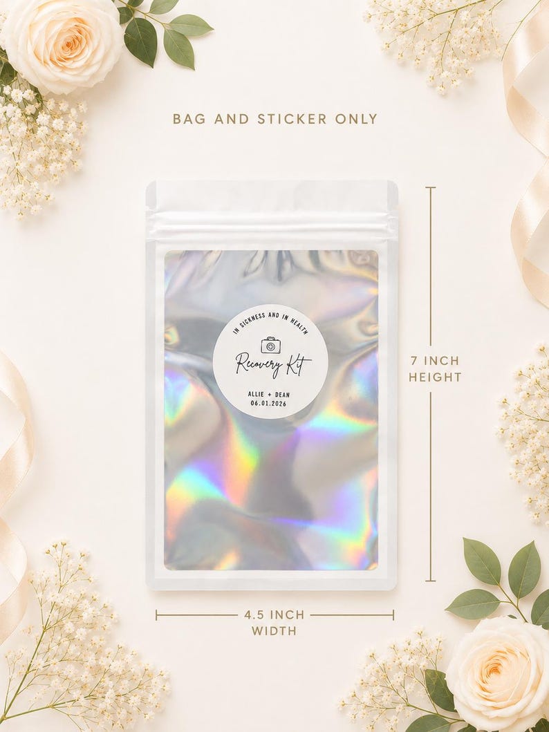 May include: A holographic, iridescent pouch with a white zipper seal, measuring 7 inches in height and 4.5 inches in width. A circular white sticker on the front features a camera icon, the text In Sickness and in Health, Recovery Kit, Allie + Dean, and 06.01.2026.