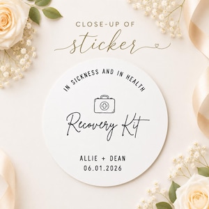 May include: A round white sticker featuring the black text IN SICKNESS AND IN HEALTH, a line art medical kit icon, the script text Recovery Kit, and the personalised text ALLIE + DEAN followed by the date 06.01.2026 in a clean sans-serif font.