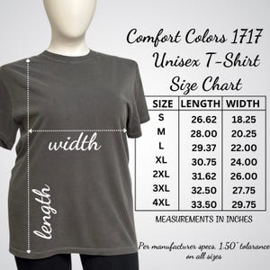 May include: A grey Comfort Colors 1717 unisex t-shirt on a mannequin, with a size chart. The chart shows measurements in inches, with the length and width of the shirts for sizes S to 4XL. Measurements are provided.