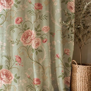 May include: A sage green curtain featuring a repeating floral pattern of pink roses, green leaves, and delicate swirling vines. The fabric has a subtle textured appearance, and the design includes small light pink blossoms scattered throughout.