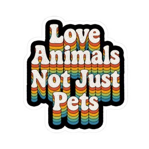 Puede incluir: Una pegatina de estilo retro con el texto "Love Animals Not Just Pets" en blanco, delineado en negro. El texto tiene un efecto en capas de arcoíris, con tonos naranja, amarillo, verde y azul.