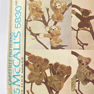 May include: A vintage McCall's sewing pattern for making stuffed animals. The pattern includes instructions for making a monkey, a koala, and a raccoon. The pattern is from 1975 and is in good condition.