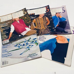 May include: A collection of vintage sewing magazines featuring cover models wearing vests and jackets. The magazines showcase articles on embroidery, pattern alteration, and fabric techniques. The covers display text such as "Vest", "Ruffles", and "Download this Free Design".