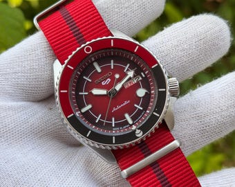 Seiko 5 Sports SARADA UCHIHA Special Edition Red Dial Automatic WristWatch Day-Date Japan Refurbished.