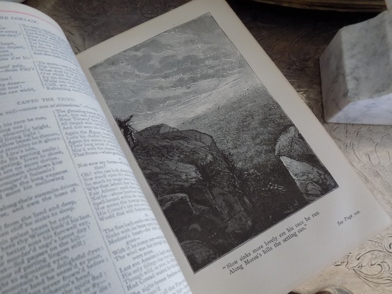 May include: A black and white illustration of a mountain range with a quote from the book "Childe Harold's Pilgrimage" by Lord Byron. The quote reads: "Slow sinks more lovely ere his race be run Along Morea's hills the setting sun."