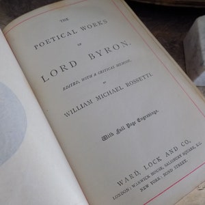 May include: The cover of a book titled "The Poetical Works of Lord Byron" edited by William Michael Rossetti. The book is published by Ward, Lock and Co. and features full page engravings.