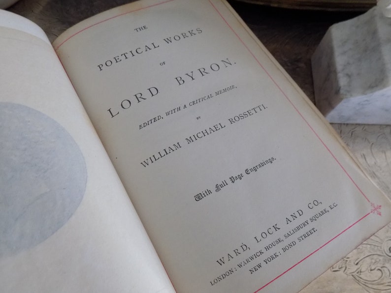 May include: The cover of a book titled "The Poetical Works of Lord Byron" edited by William Michael Rossetti. The book is published by Ward, Lock and Co. and features full page engravings.