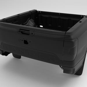 May include: A black truck bed with the word "RANGER" embossed on the tailgate. The bed has a rectangular shape with a deep cargo area and a built-in tailgate handle. The taillights are visible on the sides.