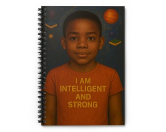 May include: Spiral-bound notebook featuring a portrait of a young person wearing an orange t-shirt with the words "I AM INTELLIGENT AND STRONG" in gold lettering. The background is a dark blue with celestial elements.