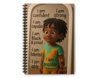 May include: Spiral-bound notebook featuring a cartoon illustration of a smiling child. The notebook's cover includes text that reads "I am confident, strong, capable, Black & proud, talented, able, possible. My future is bright."