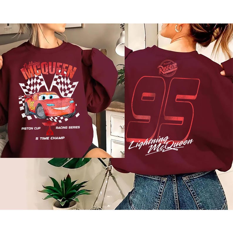 May include: A white ceramic mug with a black handle and the text "But First, Coffee" in a black, handwritten-style font. The mug is on a white surface.