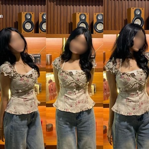 May include: A beige short-sleeved top with a pink floral pattern, featuring a square neckline, ruffled trim, and a button-down front, paired with blue denim jeans. The text Hani Pattern Co. is visible in the upper left corner of the image.