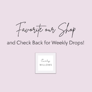 May include: A light pink background with the text "Favorite our Shop" in a cursive font. Below, the text reads "and Check Back for Weekly Drops!" A small square with the words "Curly Willows" is in the bottom center.