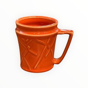 May include: A set of three ceramic mugs with a speckled, matte finish. The mugs are in shades of cream, light gray, and dark gray. Each mug has a simple, minimalist design, perfect for coffee or tea.