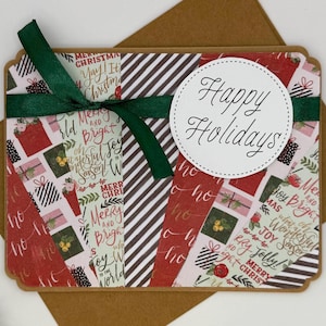 May include: A holiday greeting card with a festive design. The card features a collage of patterned paper with gift boxes and holiday phrases. A green ribbon is tied around the card, and a white circle with "Happy Holidays" is in the center.