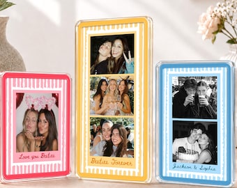 May include: Three rectangular acrylic photo frames with striped borders in pink, yellow, and blue. The pink frame displays a photo with the text Love you Besties. The yellow frame shows three photos with the text Besties Forever. The blue frame shows two photos with the text Jackson & Sophia.
