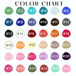 May include: A color chart featuring thirty-six numbered, irregular circular swatches arranged in a grid. Each swatch displays a distinct hue, ranging from greens, blues, and purples to reds, oranges, yellows, pinks, black, white, and various neutrals.