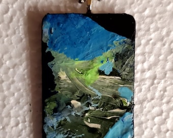 Mountain stream is an original, OOAK, handpainted pendant/necklace.  Blue skies, green hills, blue stream. Abstract landscape. Wearable art.