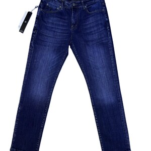 May include: Dark wash denim jeans with a classic five-pocket design. The jeans have a straight leg fit and a button and zipper closure. A brand tag is attached to the jeans.