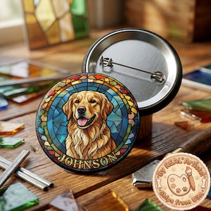 May include: A circular button badge with a golden retriever dog design in a stained-glass style. The dog's portrait is framed by blue, orange, and yellow glass-like shapes. The name "JOHNSON" is printed below the dog. Another badge is visible.