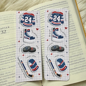 May include: Two bookmarks with hockey-themed stickers on an open book. The stickers include a jersey with the number 24, hockey skates, pucks, a hockey stick, and a glove. The text "SEE YOU NEXT SEASON" is visible.