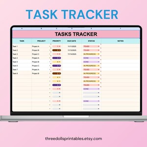 May include: A laptop displays a digital task tracker spreadsheet. The screen shows a table with columns for task, project, priority, due date, status, and notes. The text "TASK TRACKER" is at the top, and the website threedollsprintables.etsy.com is at the bottom.