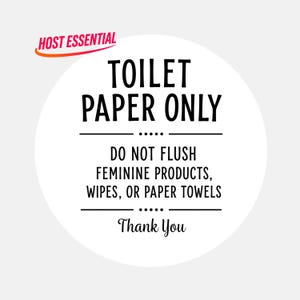 Puede incluir: Un letrero circular blanco con texto negro que dice: HOST ESSENTIAL, TOILET PAPER ONLY, DO NOT FLUSH FEMININE PRODUCTS, WIPES, OR PAPER TOWELS, Thank You. El letrero presenta líneas horizontales y puntos decorativos entre las líneas.