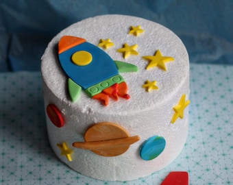 Fondant Rocket, Stars and Planet Cake Decorations for a Space Party Birthday Cake