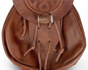 May include: A brown leather sporran with a Celtic knot design embossed on the flap. The sporran features a flap closure with a wooden toggle and leather drawstrings. The bag is a traditional accessory.