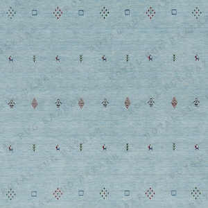 May include: A light blue rug with a repeating pattern of small geometric shapes and stylized figures in red, green, and black. The rug has a textured appearance.