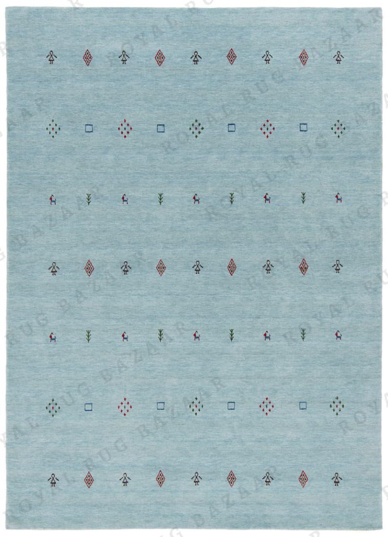 May include: A light blue rectangular rug with a repeating pattern of small geometric shapes and figures in red, green, and black. The rug has a simple, minimalist design, suitable for various interior styles.