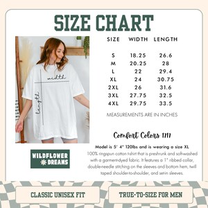 May include: White t-shirt with a size chart, featuring measurements in inches. The chart lists sizes S to 4XL, with width and length dimensions. The shirt is preshrunk, soft-washed cotton with a ribbed collar and double-needle stitching. The brand is Wildflower Dreams.
