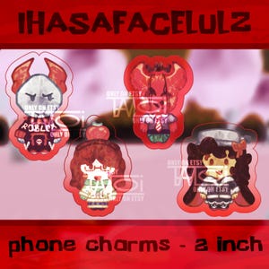 Puede incluir: Cuatro colgantes para teléfono con contorno rojo, cada uno con un diseño único de personaje de dibujos animados. Los colgantes miden aproximadamente 5 cm. El texto "IHASAFACELULZ" y "phone charms - 2 inch" son visibles. Cada colgante tiene el texto "ONLY ON ETSY".