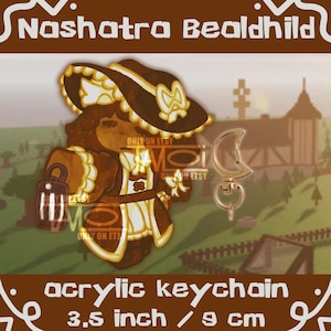 May include: An acrylic keychain featuring a cartoon character in a brown and cream outfit and hat. The keychain includes a gold-colored moon-shaped clasp. The text "acrylic keychain" and "3.5 inch / 9 cm" are at the bottom.