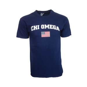 May include: A navy blue t-shirt with the text "CHI OMEGA" in white letters and a small American flag printed on the front.