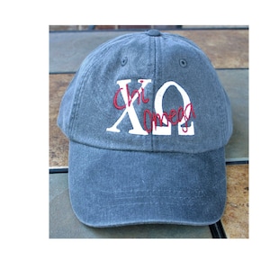 Custom baseball cap with greek letters and script overlay