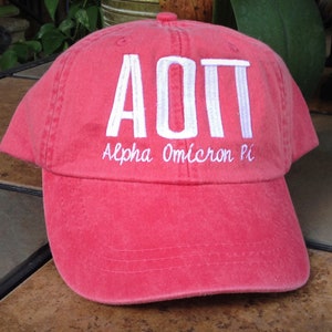 Alpha Omicron Pi script with BIG and LITTLE added to the back of baseball cap