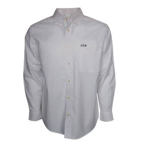 May include: A white long-sleeve button-down shirt with a pocket on the left side. The shirt has a small embroidered logo that says "A2D".