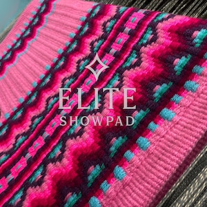May include: Pink and magenta show pad with a geometric pattern, accented with teal and dark purple. The pad features the text "ELITE SHOWPAD" in white. The pad is designed for equestrian use.