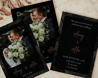 May include: Two rectangular wedding invitation cards with a black background and dark floral border. One card features a photograph of a couple holding a white flower bouquet, with the text Anny & Alex and June 15, 2026. The other card displays text details.