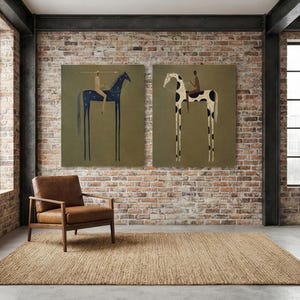May include: Two large canvas art pieces depict stylized horses with riders against an olive green background. One horse is blue with white dots, the other is black and white. A brown leather armchair and a woven rug complete the room.