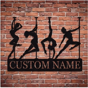 May include: A black metal wall art piece featuring four silhouettes of individuals performing pole dance moves on vertical poles. Below the figures, a rectangular base plate displays the text CUSTOM NAME in bold, capitalized, sans-serif lettering.