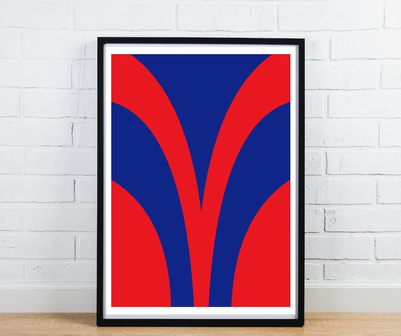 May include: Framed abstract art print featuring a bold design. The artwork showcases a vibrant composition of red and blue curved shapes against a white background. The black frame adds a modern touch to the overall aesthetic.