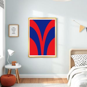 May include: A framed abstract art print featuring a bold design of red and blue curved shapes. The artwork is displayed in a gold frame, adding a touch of elegance. The print is a vibrant piece of wall decor.