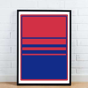 May include: A framed abstract art print with a striking colour scheme. The artwork presents a composition of red and blue rectangular shapes and horizontal lines. The print is enclosed in a black frame, enhancing its modern appeal.
