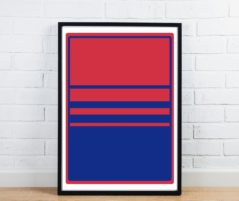May include: A framed abstract art print with a striking colour scheme. The artwork presents a composition of red and blue rectangular shapes and horizontal lines. The print is enclosed in a black frame, enhancing its modern appeal.