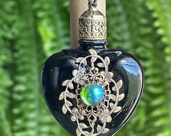 Collar vintage de botella de perfume de vidrio negro con aceite esencial