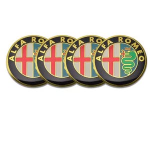 May include: Four circular Alfa Romeo emblems. Each emblem features a red cross on a white background, a green and blue background, and a gold border. One emblem has a green serpent.